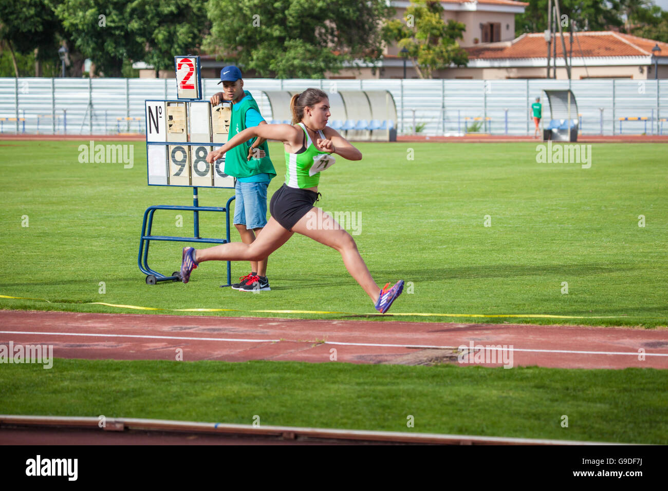 sports girl performing long jump on an athletic piste Stock Photo Alamy
