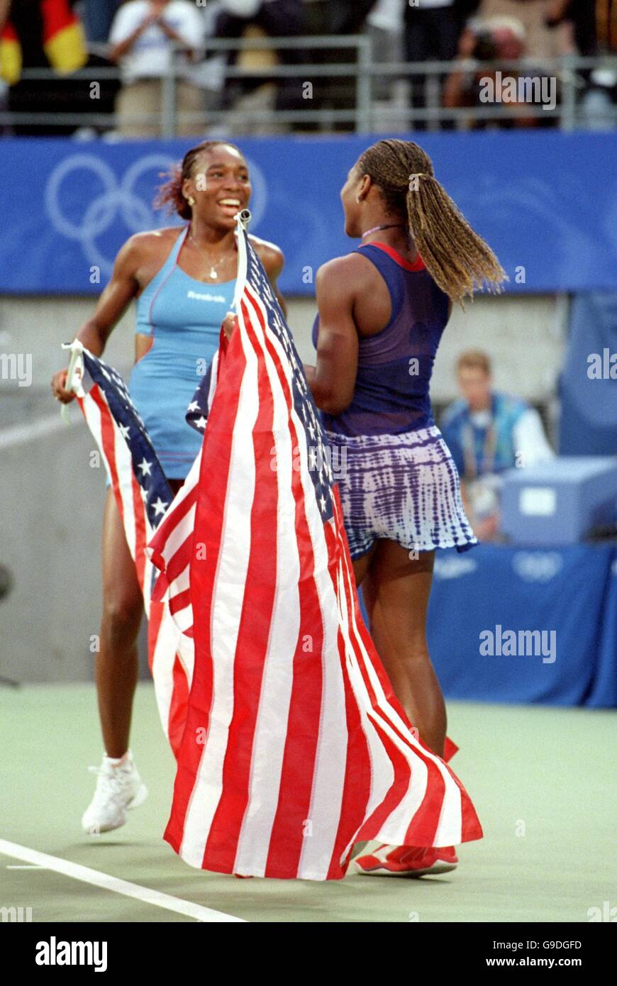 The USA's Serena and Venus Williams celebrate their Olympic Gold medal