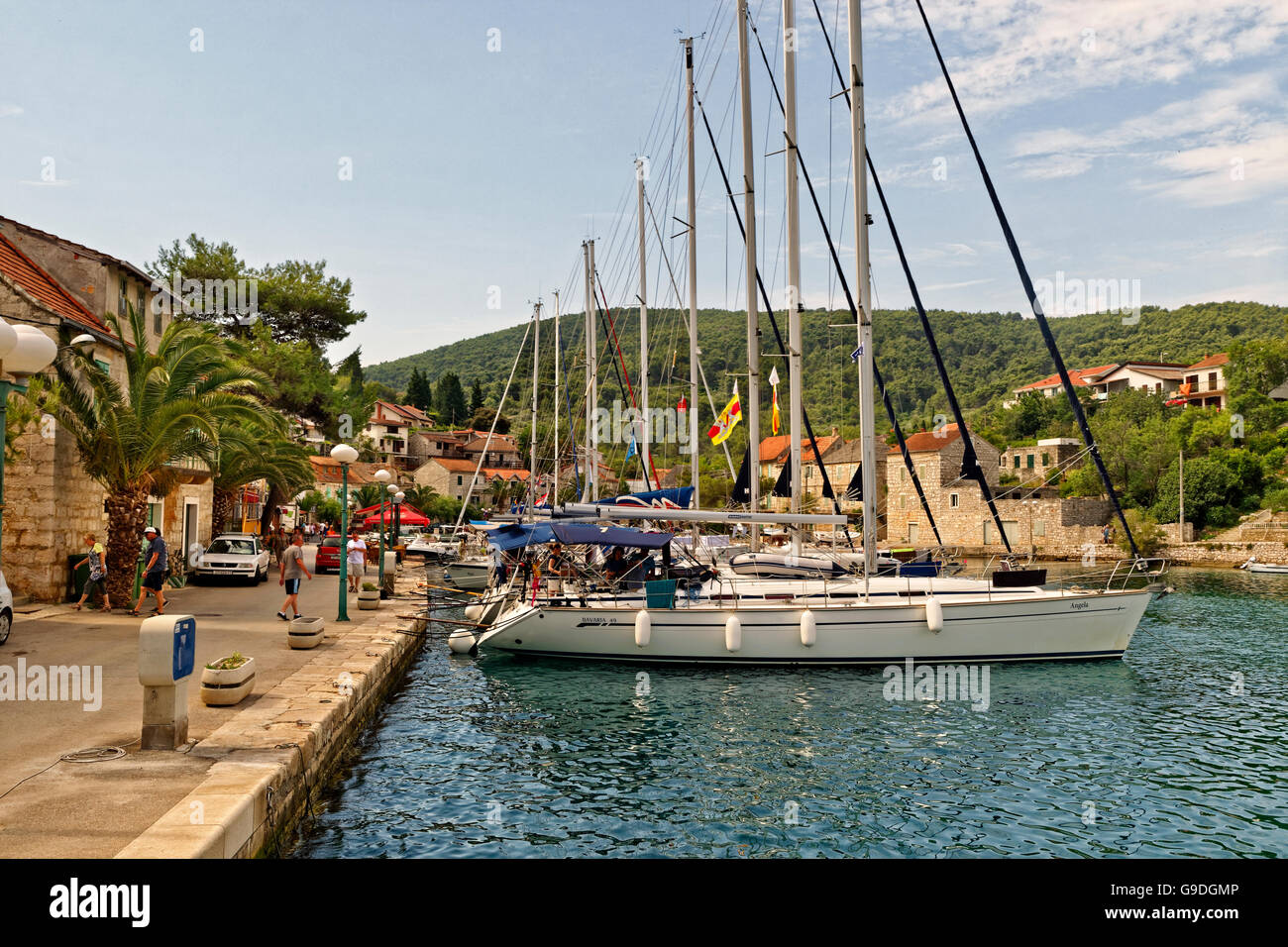 Charter yachts berthed at the village quay of Stomorska on the island of Solta in Croatia. Stock Photo