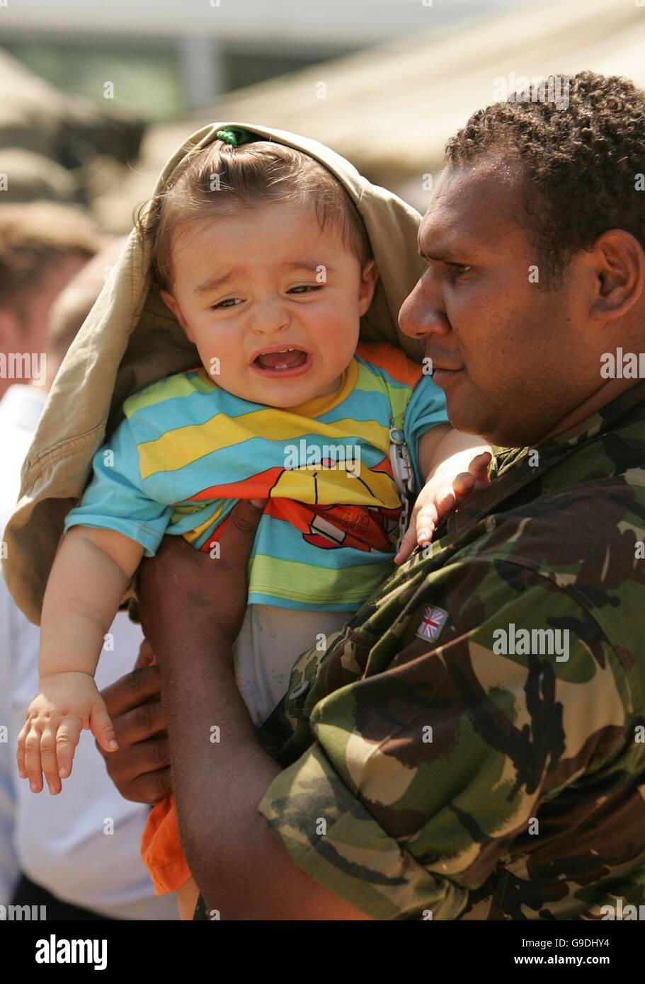 British soldiers help evacuees at the Akrotiri RAF Base in Cyprus