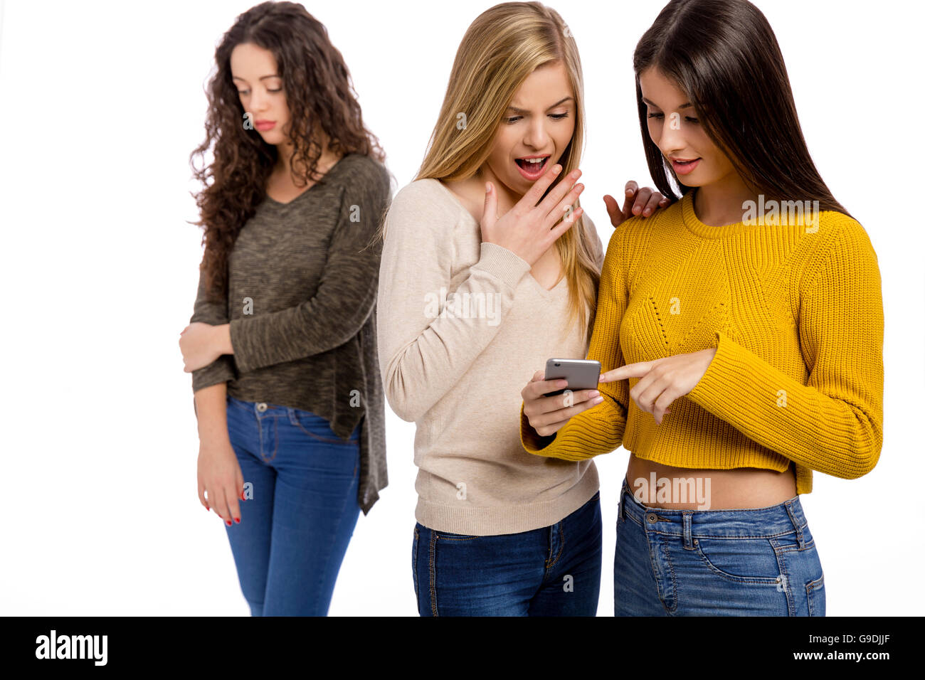 Teenagers making gossip from other girl Stock Photo