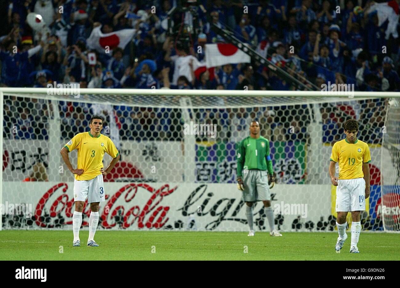 Soccer - 2006 FIFA World Cup Germany - Group F - Japan v Brazil - Signal Iduna Park. Brazil's Lucio (l), Dida and Pernambucano Juninho (r) stand dejected after the opening goal scored by Japan's Keiji Tamada Stock Photo