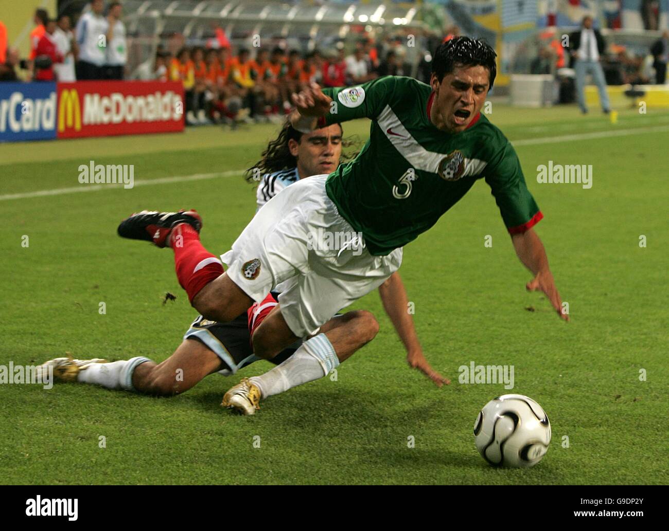 Soccer - 2006 FIFA World Cup Germany - Second Round - Argentina v Mexico - Zentralstadion. Argentina's Juan Pablo Sorin fouls Mexico's Ricardo Osorio Stock Photo