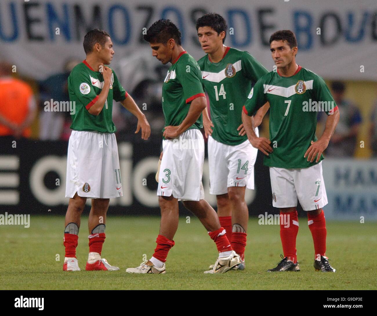 Soccer - 2006 FIFA World Cup Germany - Second Round - Argentina v Mexico - Zentralstadion. Mexico's Antonio Zinha, Carlos Salcido and Gonzalo Pineda stand dejected after losing to Argentina Stock Photo