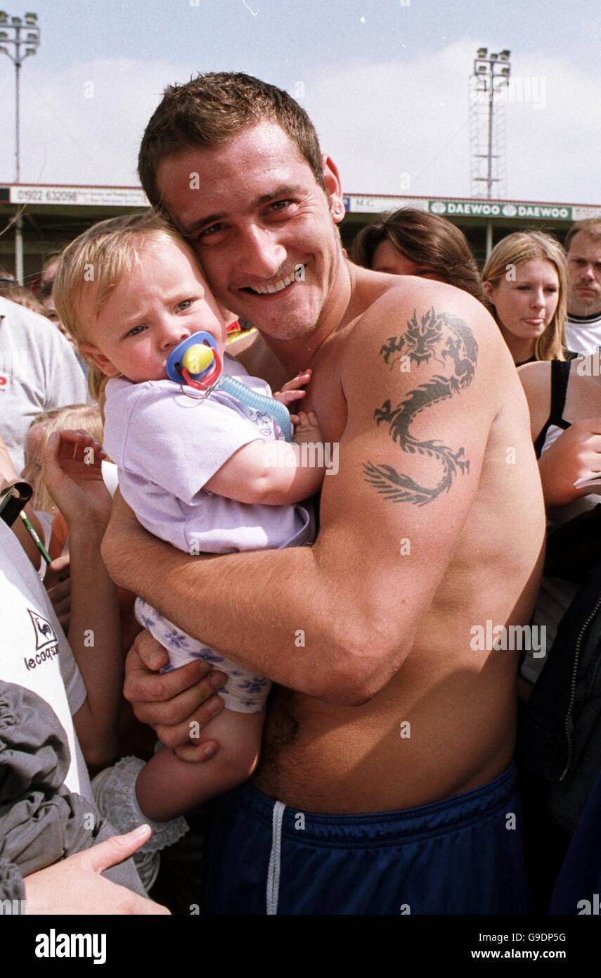Will Mellor, former star of TV's Hollyoaks, meets 10 month old Amelia Lloyd  from Goscote near Walsall, during a charity football match at Walsall's  Bescot Stadium Stock Photo - Alamy