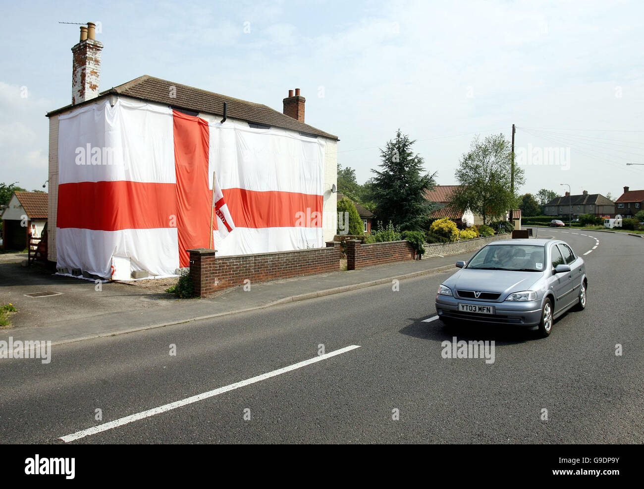 The house of John and Elaine Jupp is covered in an England flag. Stock Photo
