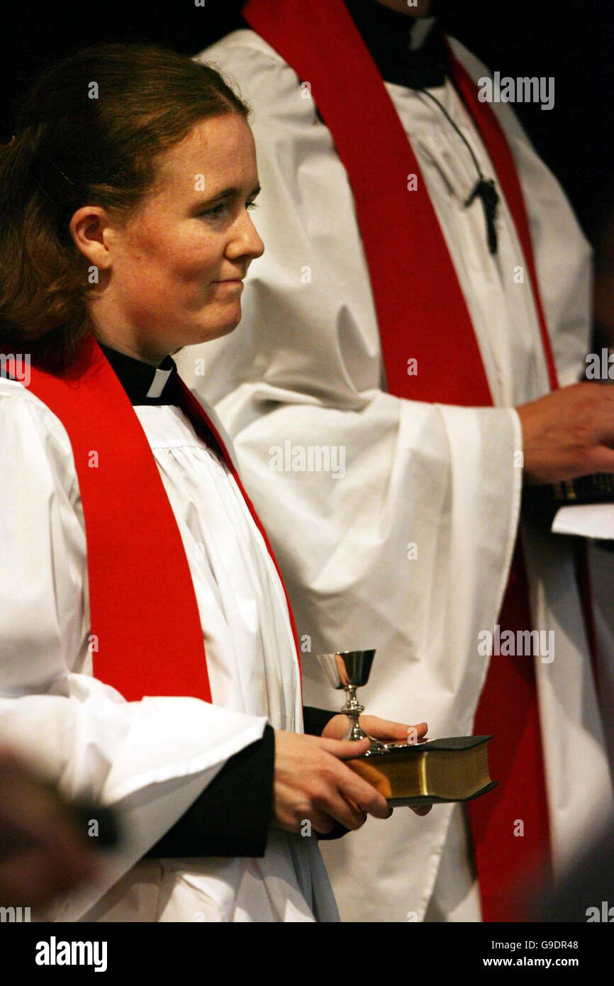 The Revd Elaine Dunne holds her bible, chalace and paten after her ordination at a special Church of Ireland service at Christ Church Cathedral, Dublin. Stock Photo