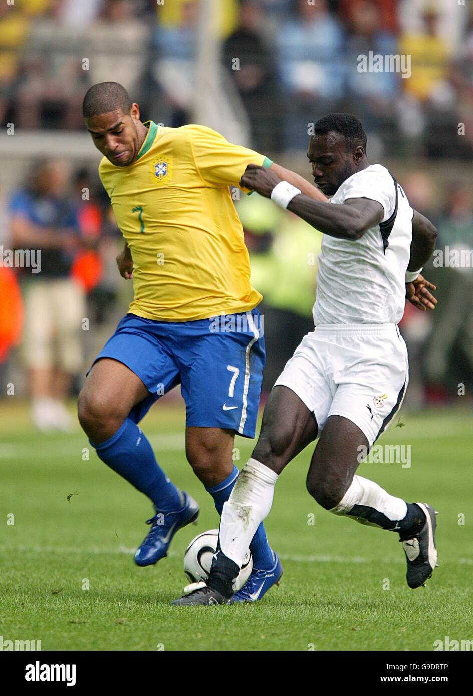 Soccer - 2006 FIFA World Cup Germany - Second Round - Brazil v Ghana - Signal Iduna Park. Ghana's John Mensah and Brazil's Adriano battle for the ball Stock Photo