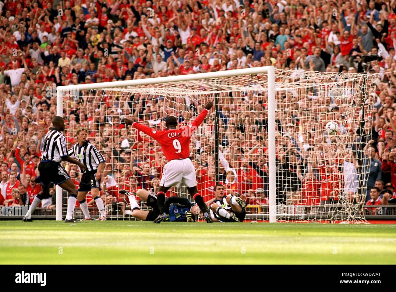 (L-R) Newcastle United's Carl Cort, Warren Barton, Shay Given and Aaron Hughes can only watch as Manchester United's Andy Cole celebrates Ronnie Johnsen's headed goal Stock Photo
