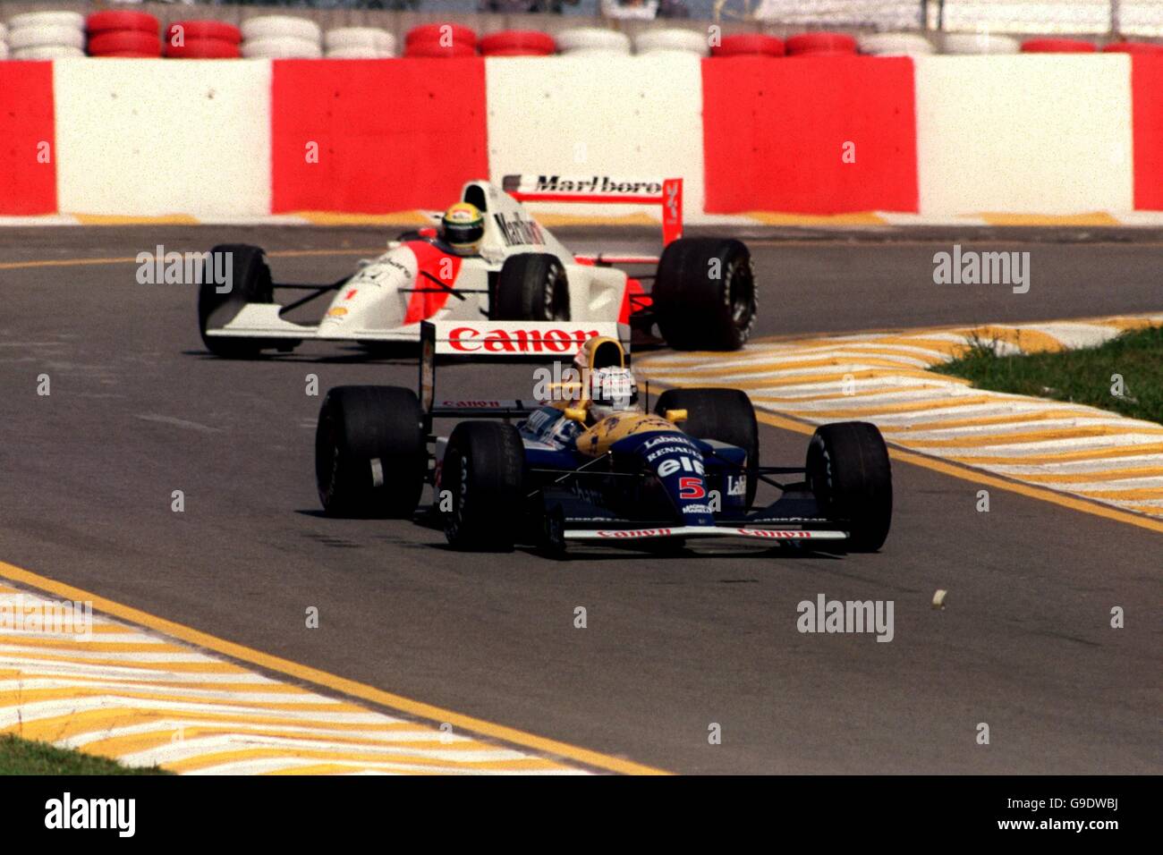 MOTOR RACING. NIGEL MANSELL LEADS AYRTON SENNA DURING PRACTICE FOR