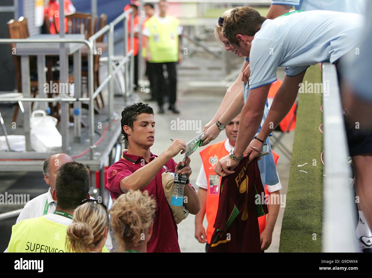 Soccer - 2006 FIFA World Cup Germany - Quarter Final - England v Portugal - AufSchalke Arena. Portugal's Cristiano Ronaldo signs autographs as he leaves the stadium Stock Photo