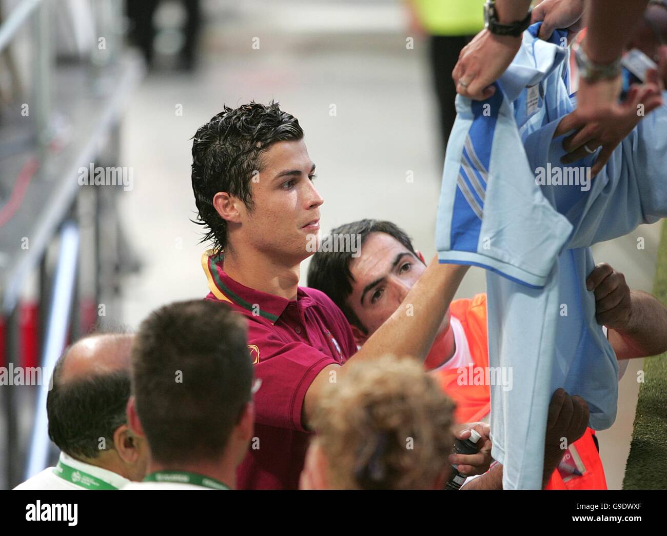 Portugal's Cristiano Ronaldo signs autographs as he leaves the stadium Stock Photo