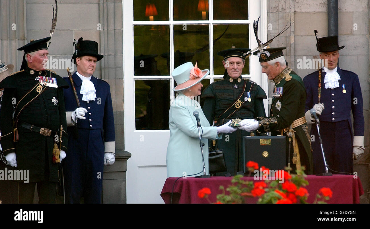 Lord Airlie, Captain General of The Royal Company of Archers presents a Redendo to Queen Elizabeth II at Holyroodhouse in Edinburgh. Stock Photo