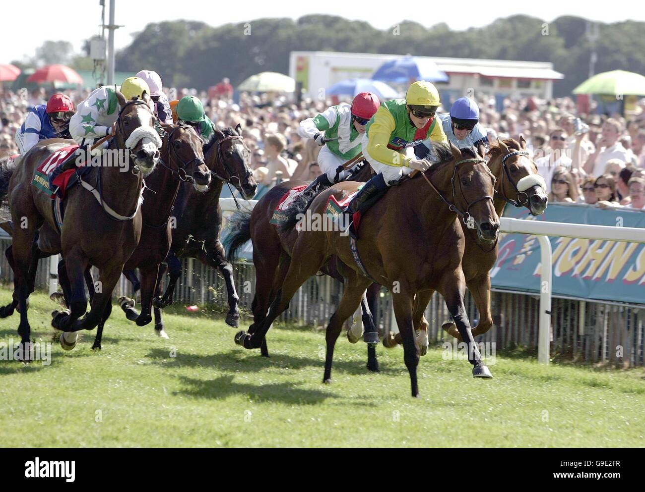 Fairmile, ridden by Alan Kirby (second from right) goes on to win the John Smith's Cup Heritage Handicap at York Racecourse. Stock Photo