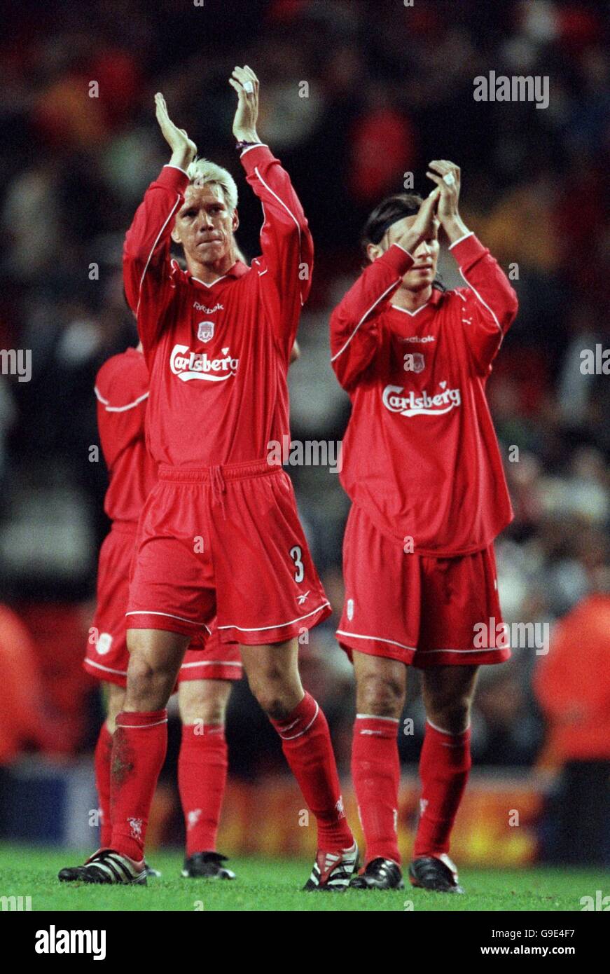 Soccer - UEFA Cup - First Round Second Leg - Liverpool v Rapid Bucharest. Liverpool's Christian Ziege (l) and Patrik Berger (r) applaud the fans after the match Stock Photo