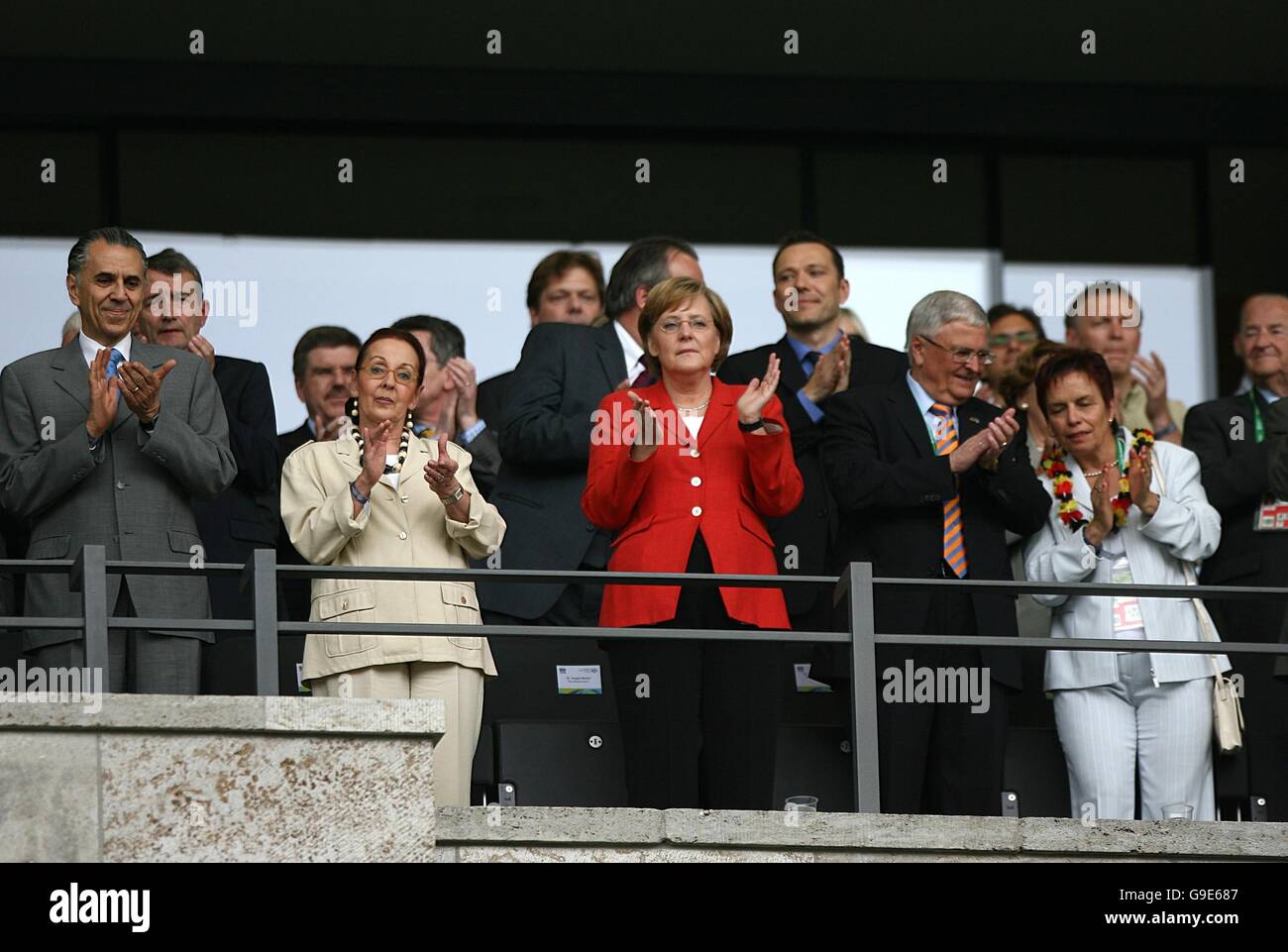 Soccer - 2006 FIFA World Cup Germany - Quarter Final - Germany v Argentina - Olympiastadion. German Chancellor Angela Merkel (C) applauds the teams Stock Photo