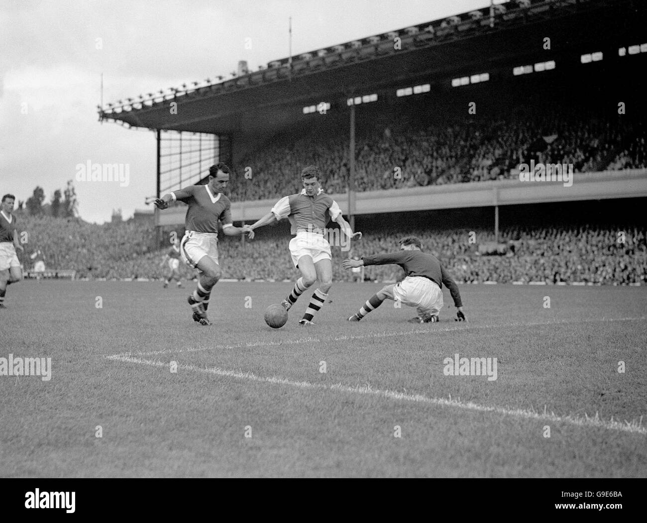 Arsenal's Danny Clapton (c) is denied by Cardiff City's Ron Stitfall (l ...