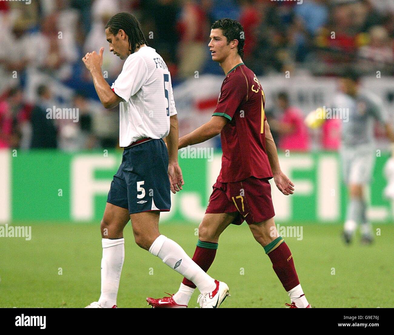 Soccer - 2006 FIFA World Cup Germany - Quarter Final - England v Portugal - AufSchalke Arena. England's Rio Ferdinand and Portugal's Cristiano Ronaldo, Manchester United team mates Stock Photo