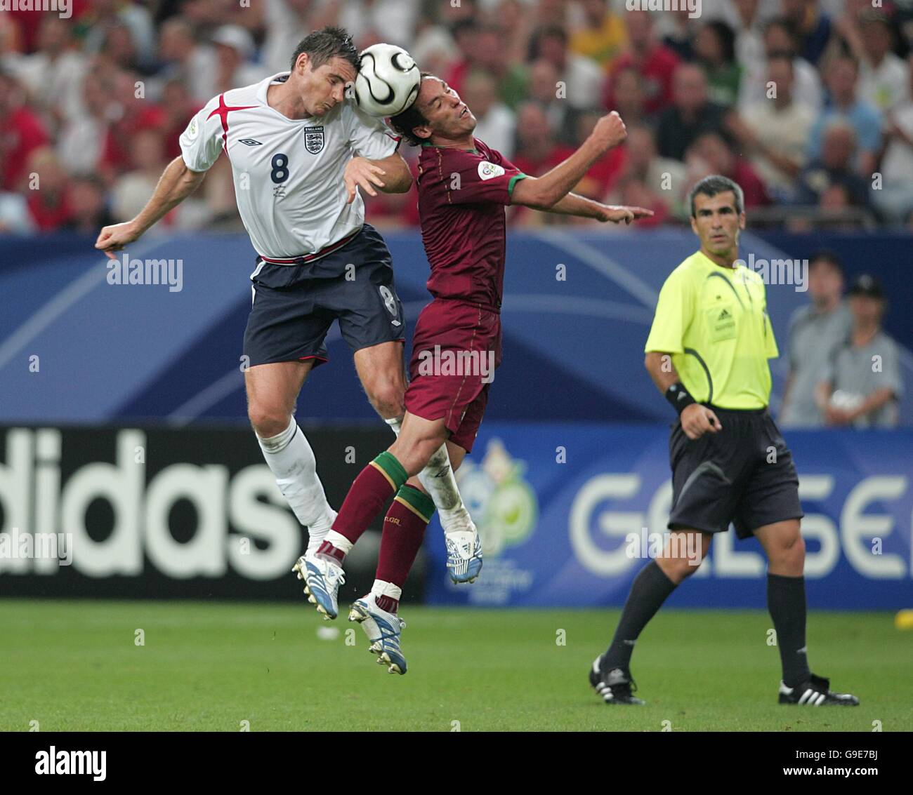 Soccer - 2006 FIFA World Cup Germany - Quarter Final - England v Portugal - AufSchalke Arena. Frank Lampard, England and Alberto Ricardo Carvalho, Portugal battle for the ball Stock Photo