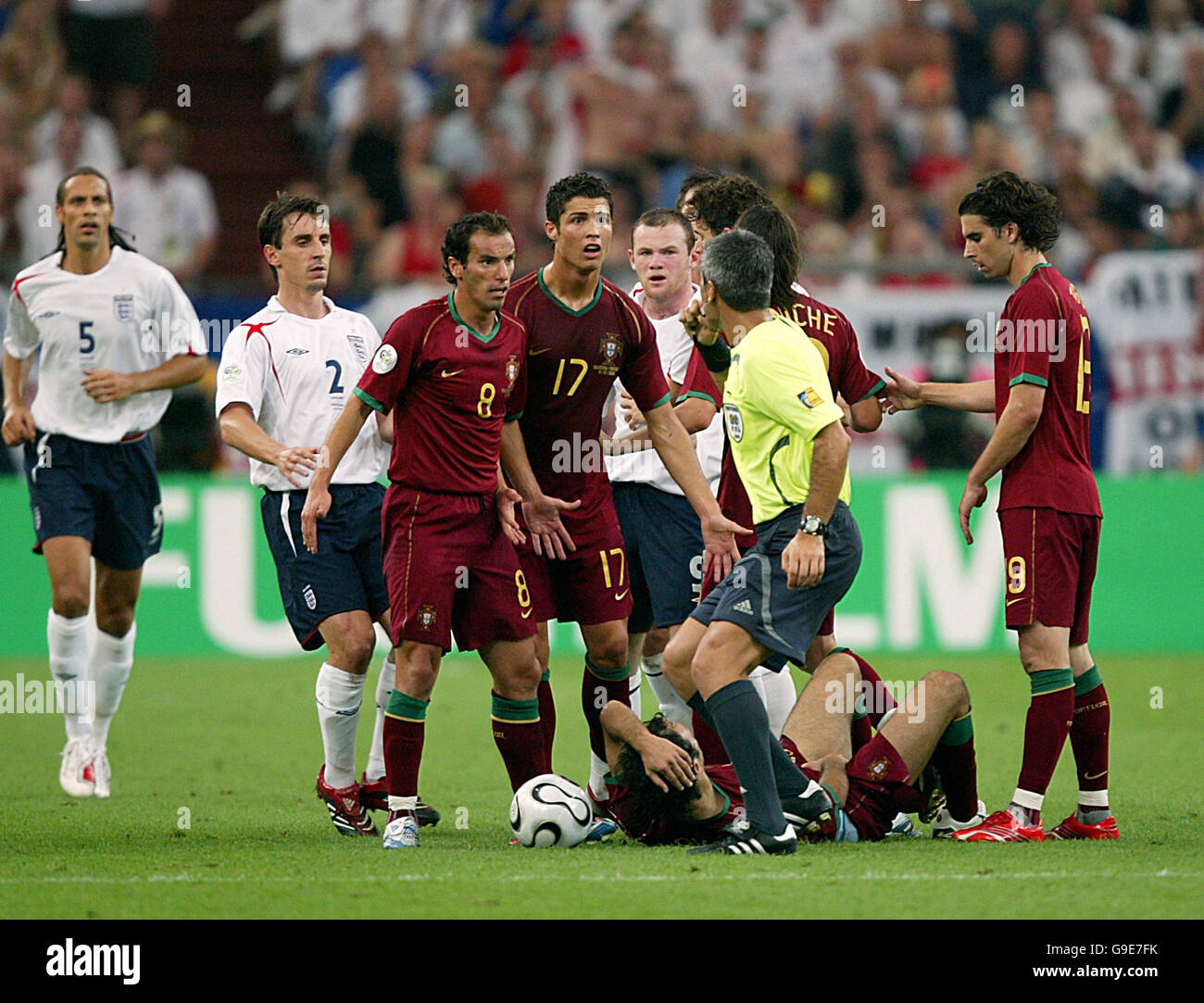 England's Wayne Rooney is sent off for a foul on Portugal's Alberto Ricardo Carvalho as Portugal's Cristiano Ronaldo and Petit surround the referee Horacio Marcelo Elizondo Stock Photo