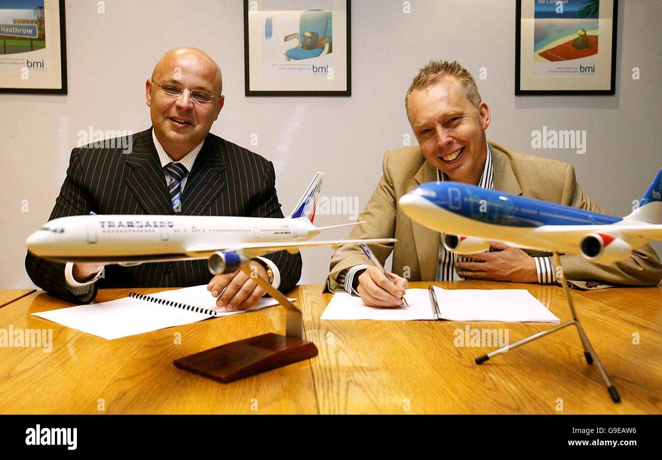 Transaero Executive Director Alexander Krinichansky (left) and BMI CEO Nigel Turner mark the commercial agreement to begin flights from London Heathrow to Moscow Domodedovo on 29th October, 2006, at Heathrow Airport, west London. Stock Photo