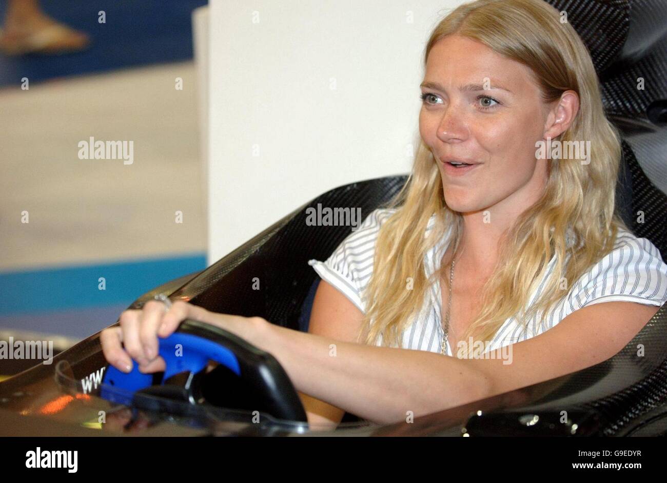 Model Jodie Kidd tries out a racing car simulator, as she attends the British International Motor Show, at the Excel Exhibition centre in Docklands, East London Stock Photo