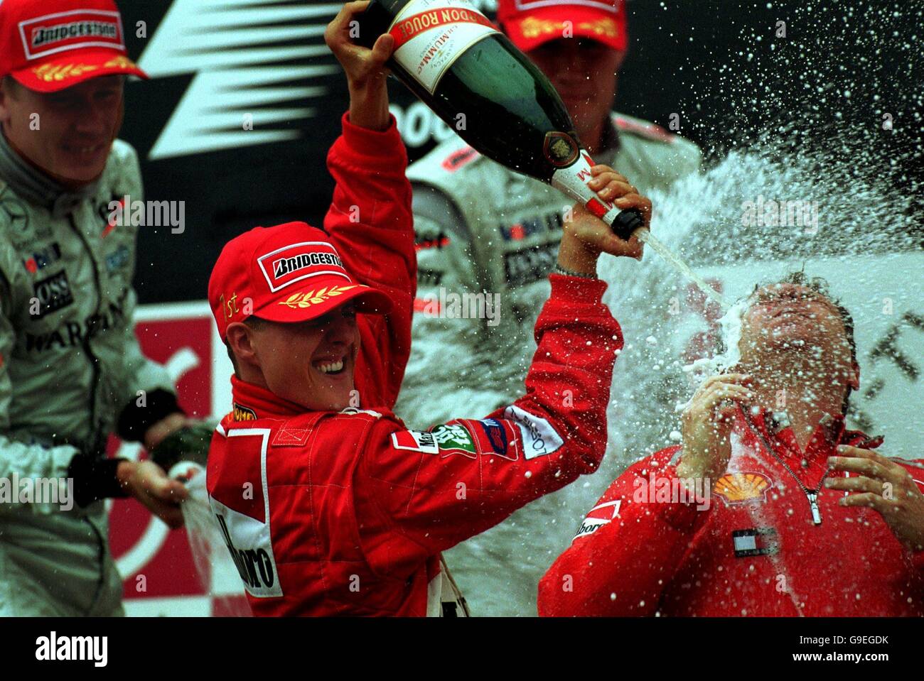 Michael Schumacher celebrates his race and world championship wins by