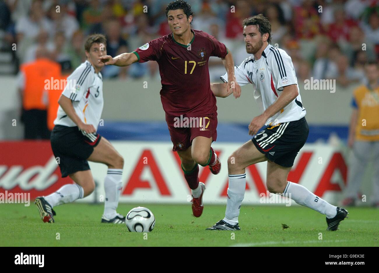 Soccer - 2006 FIFA World Cup Germany - Third Place Play-Off - Germany v Portugal - Gottlieb-Daimler-Stadion. Portugal's Cristiano Ronaldo goes down under the challenge from Germany's Christoph Metzelder Stock Photo