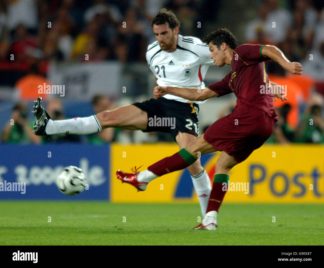 Soccer - 2006 FIFA World Cup Germany - Third Place Play-Off - Germany v Portugal - Gottlieb-Daimler-Stadion. Germany's Christian Metzalder and Portugal's Cristiano Ronaldo Stock Photo
