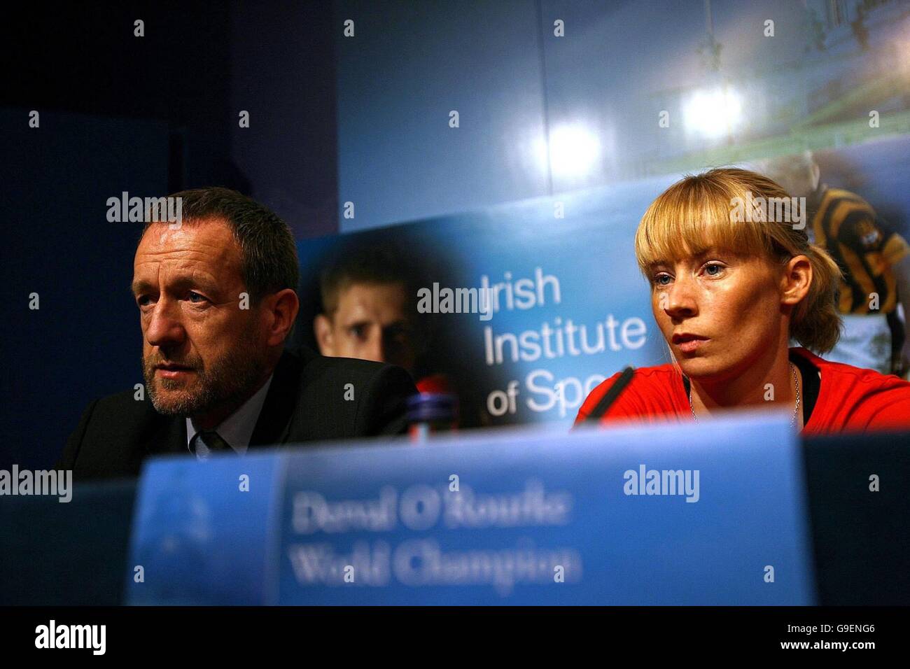Former GAA President new Executive Chairman of the Institute For Sport Sean Kelly (left) and World Champion Athlete Derval O'Rourke sit inside Government Buildings, Dublin, during the announcement of a new sports body which is to be set up to improve the performances of Ireland's elite athletes at the Olympics and other major international sporting events. Stock Photo