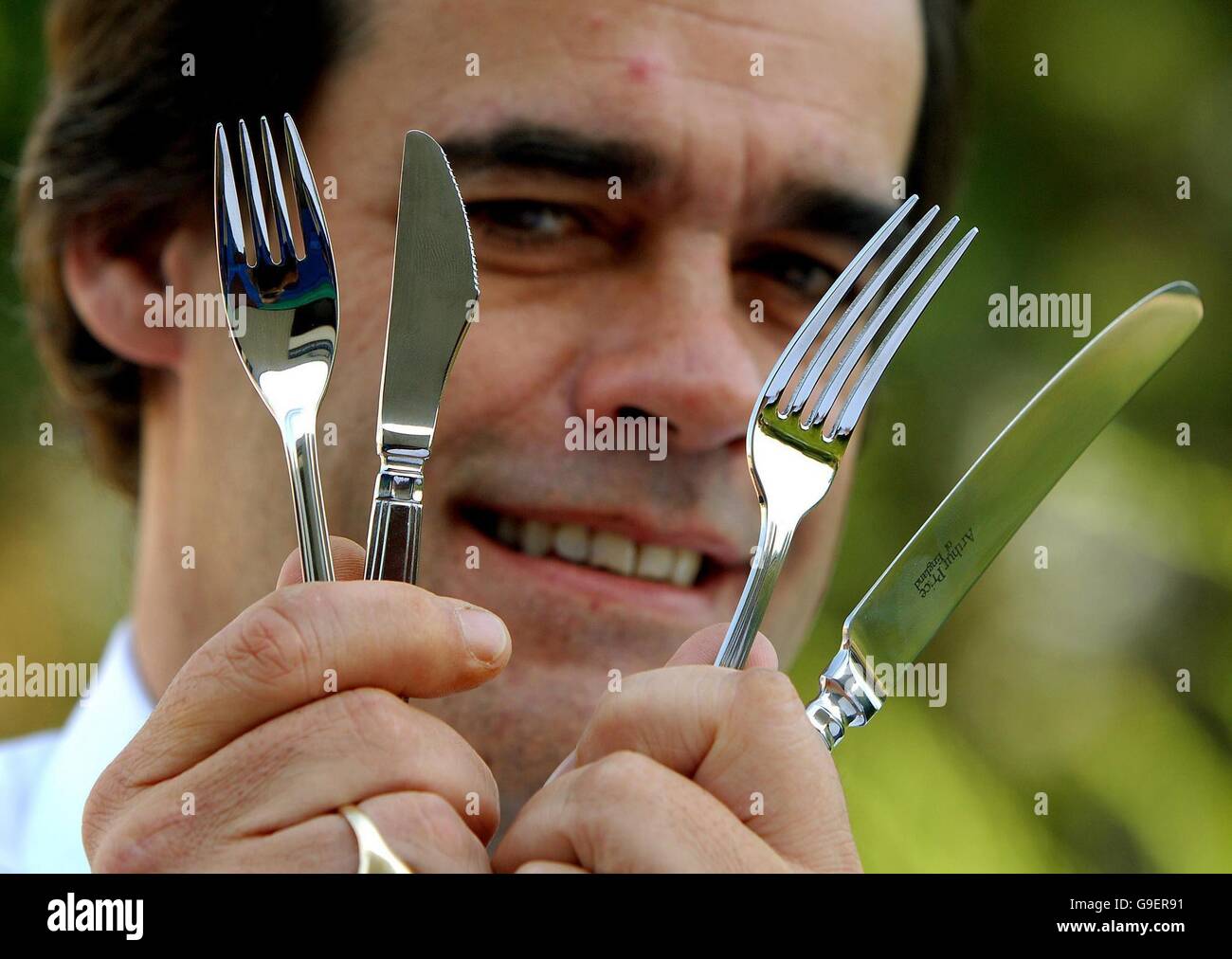 Simon Price, Chief Executive of Arthur Price knives with their new anti-terror cutlery (left) compared with standard cutlery (right). Stock Photo