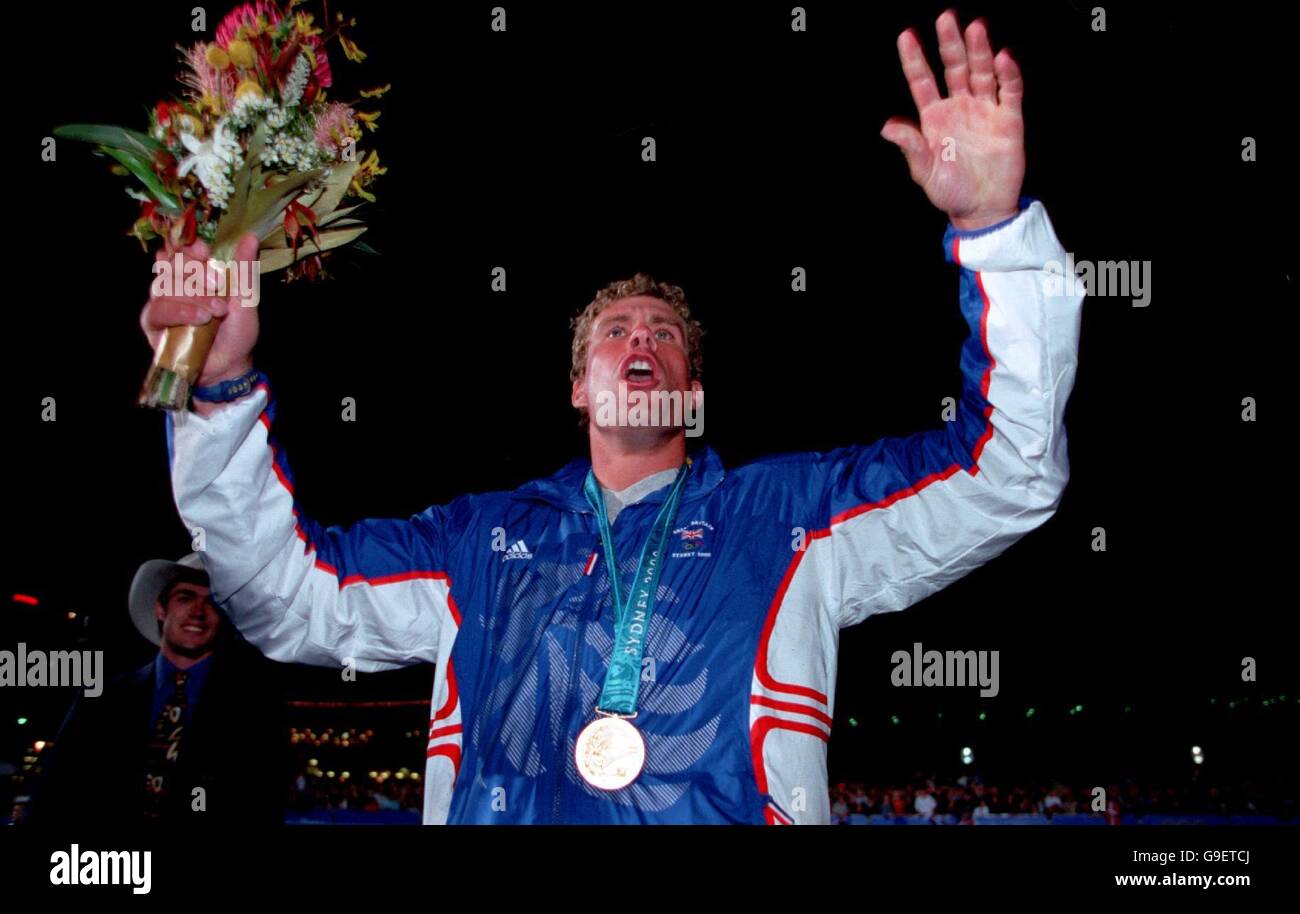 Sydney 2000 Olympics - Sailing - Medal Presentation. Great Britain's Iain Percy celebrates his Gold medal success Stock Photo
