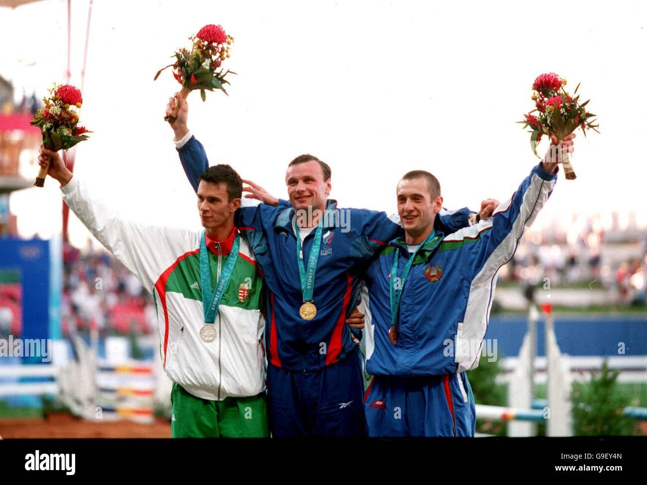 Hungary's Balogh Russia's Dmitry Svatkovsky (gold) and Belarus' Pavel Dovgal (bronze), celebrate on the podium Stock Photo - Alamy