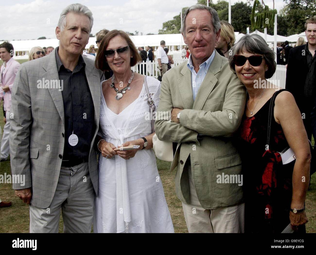 Nicholas Owen (left), Michael Buerk and their respective partners at the Guards Polo Club, Windsor Great Park. Stock Photo
