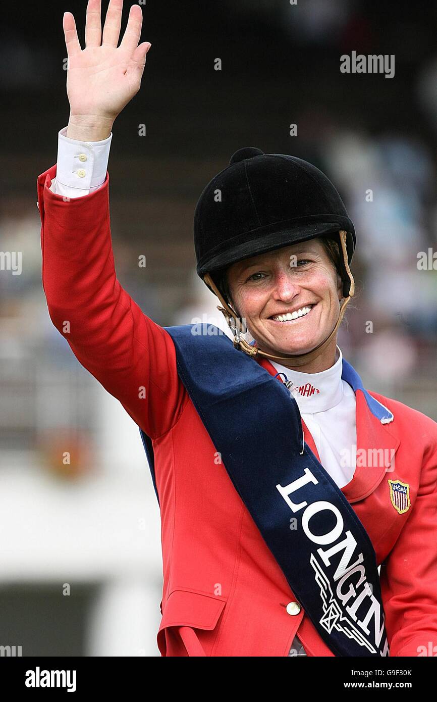 Molly Ashe, from the USA, waves to the crowd after a clear round during the Longines International Grand Prix of Ireland at the Failte Ireland Dublin Horseshow in Dublin. Stock Photo