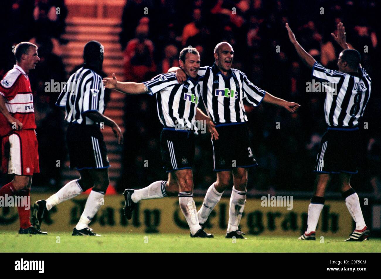 Newcastle United's Alan Shearer (c) celebrates scoring the first goal with teammates Laurent Charvet (second r) and Kieron Dyer (r) Stock Photo