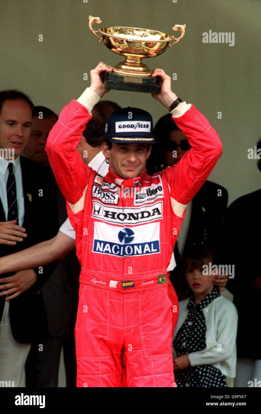 Ayrton senna celebrates his win with the trophy hi-res stock