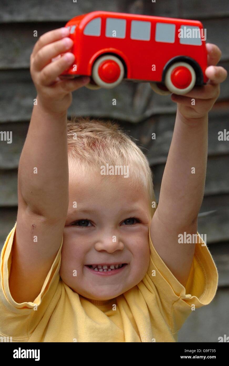 Leon Smith, 3, from Braintree, Essex holds up a toy bus,after being reunited with his mum at their home in Braintree. PRESS ASSOCIATION Photo Picture date Friday August 11 2006. The toddler went missing yesterday after taking a solo bus trip from Braintree to Colchester. See PA Story POLICE Boy. Photo credit should read: Chris Radburn/PA Stock Photo