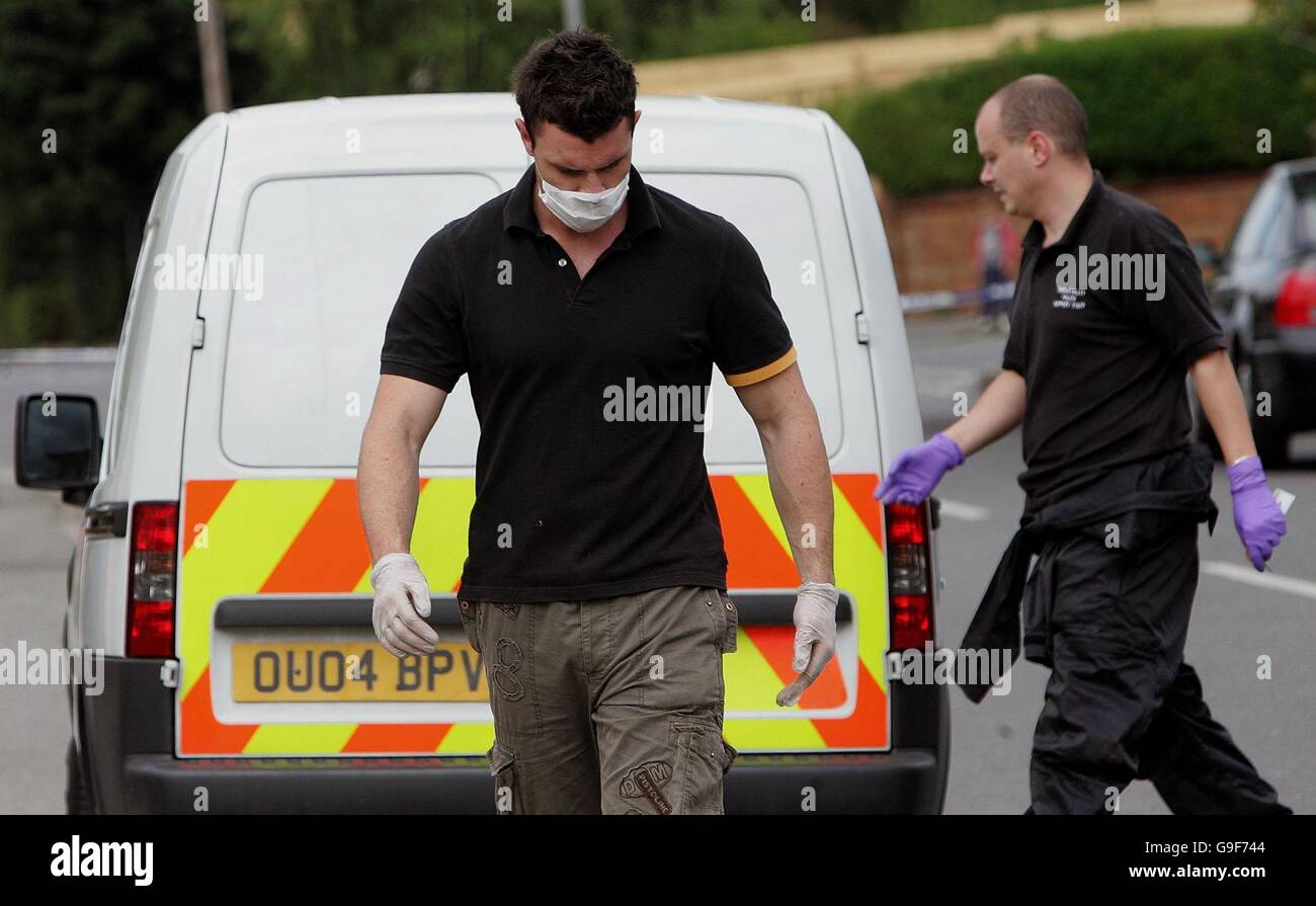 Crime Scene Police officers gathering evidence at a cordoned house in