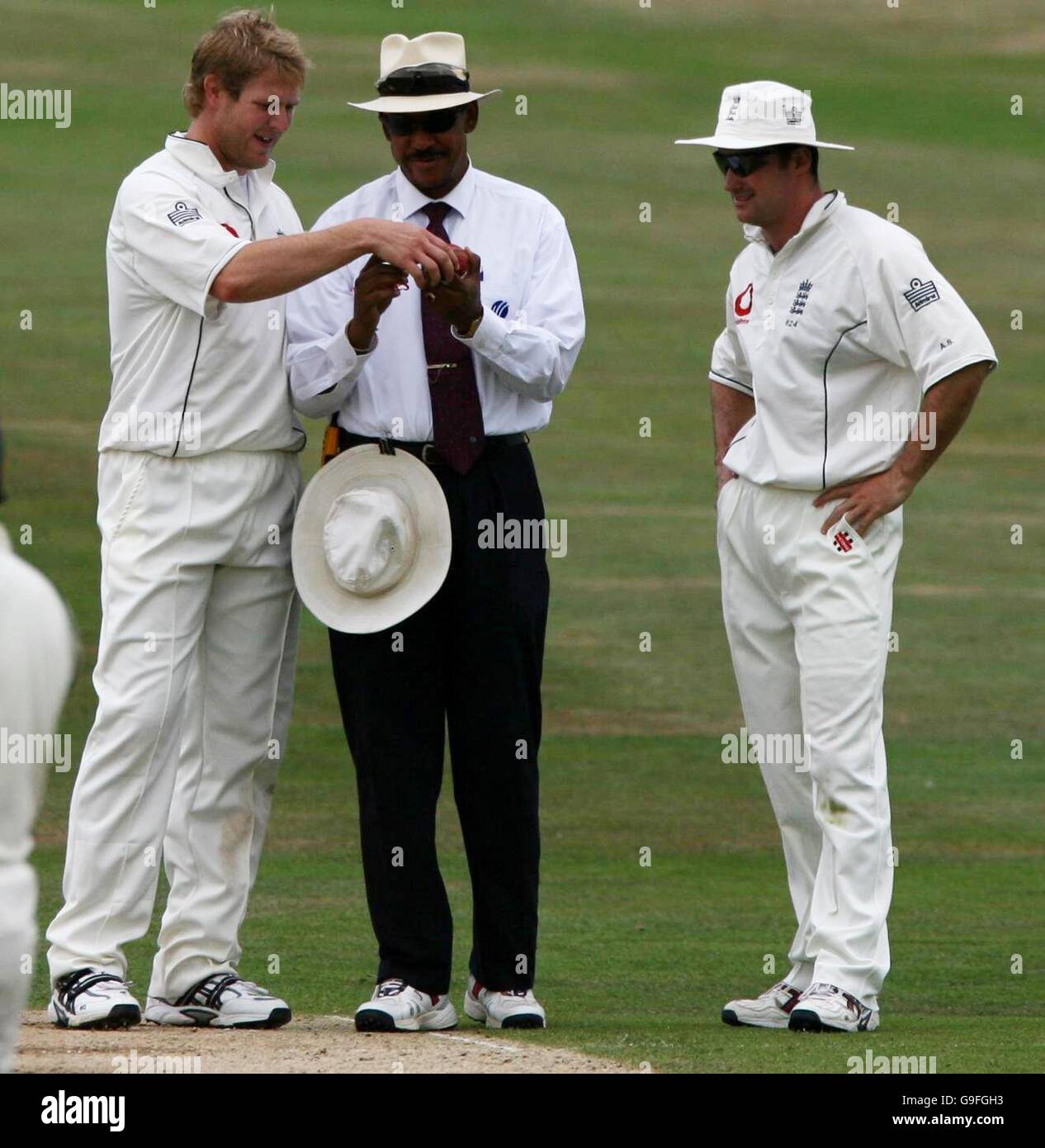 England's Matthew Hoggard (L) and captain Andrew Strauss speak to umpire Billy Doctrove on the condition of the ball during the third day of the third npower Test match at Headingley, Leeds. Stock Photo