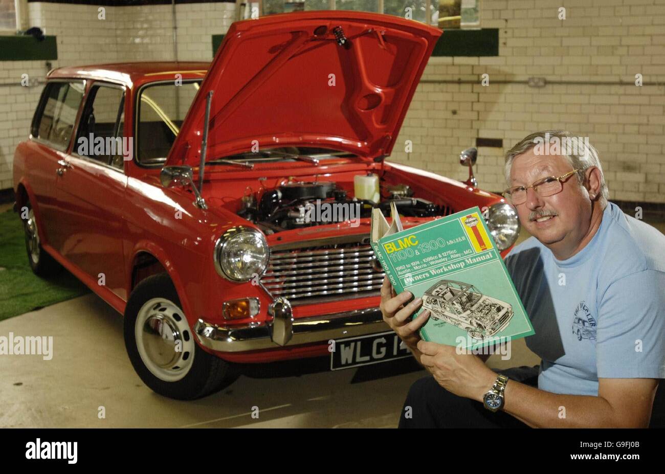 Trustee Fernand Pinckney sits next to a 1973 Austin 1100 Estate at the Whitewebbs Museum of Transport in Enfield. Stock Photo