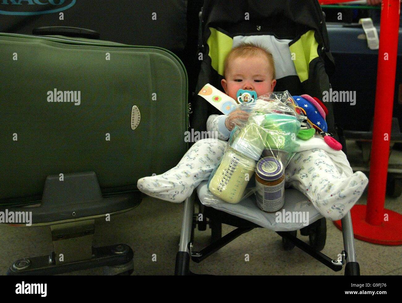 A baby with their milk which has been placed in a transparent plactic