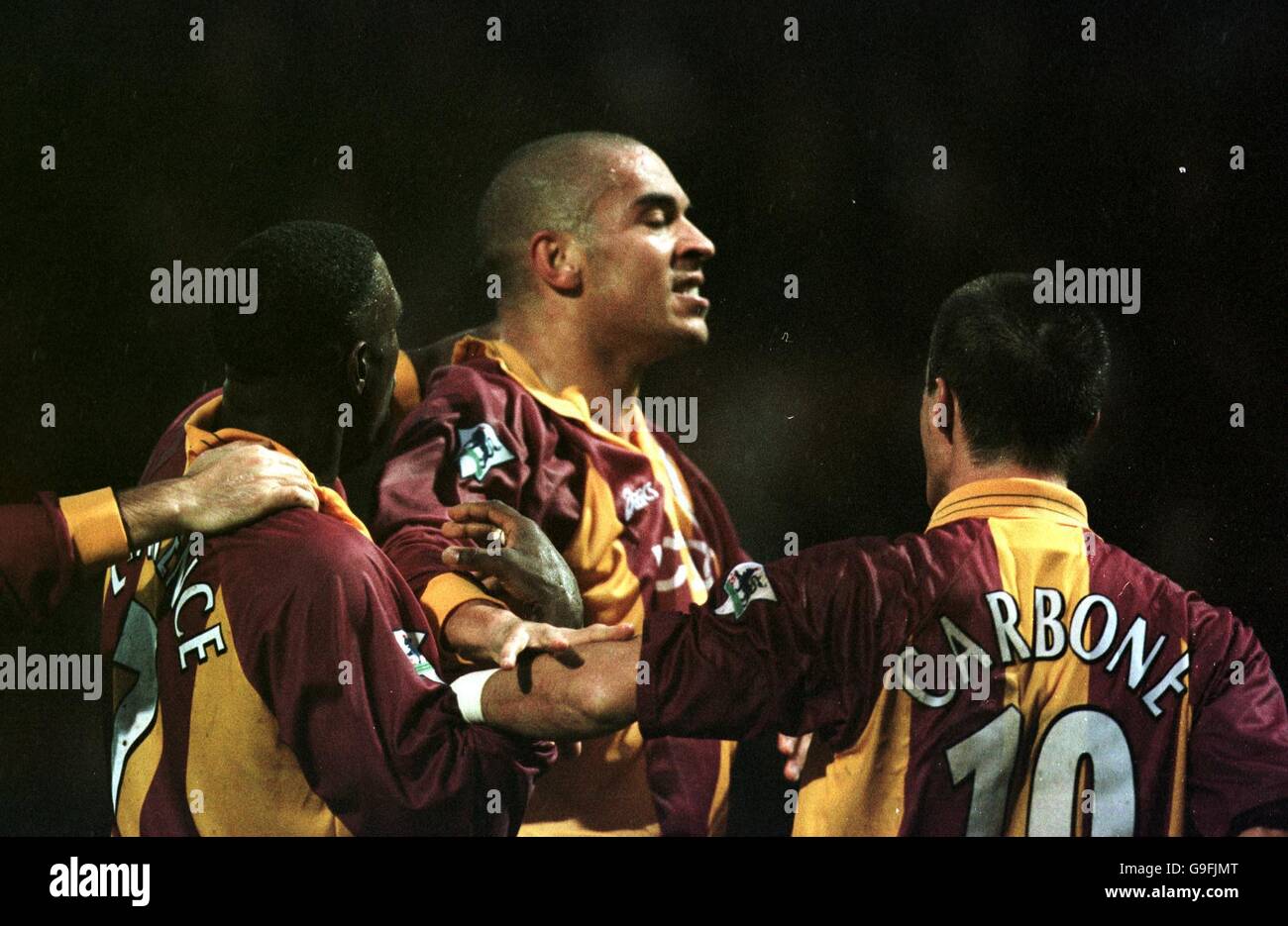 Bradford City’s Stan Collymore celebrates with teammates Jamie Lawrence