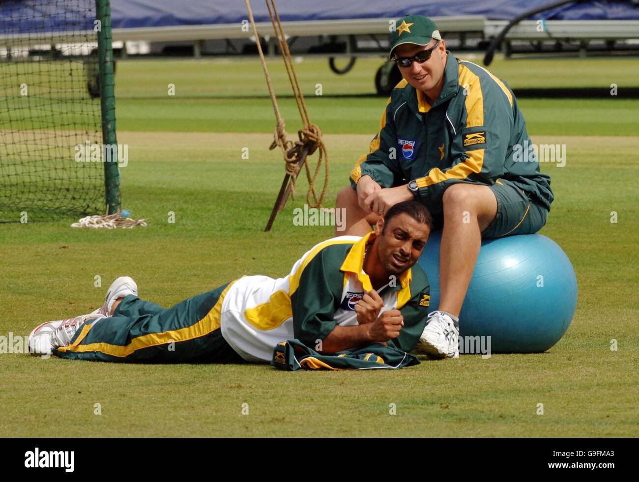 Pakistan bowler Shoaib Akhtar (bottom) with trainer Murray Stevenson during the nets session at The Brit Oval, Kennington, London. Stock Photo