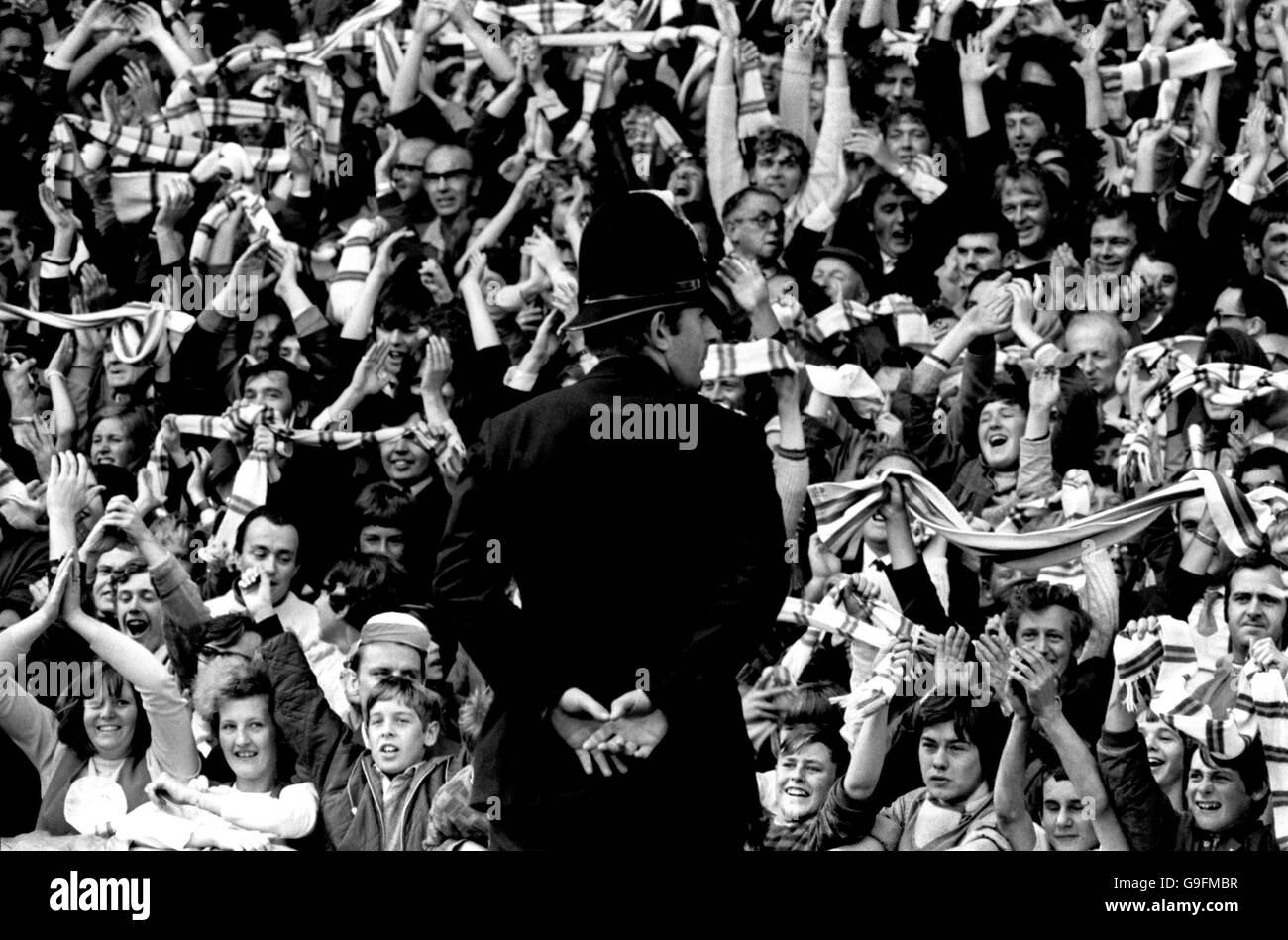 Soccer - Football League Division One - Leeds United v Chelsea - Elland Road. A policeman keeps his eye on the Leeds United fans. Stock Photo