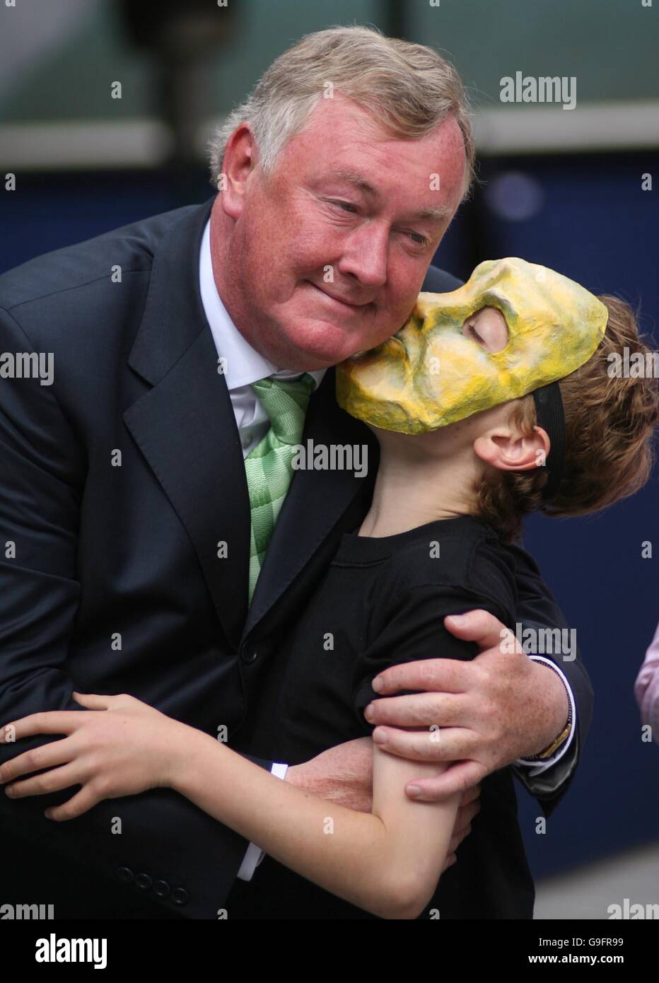 Arts minister John O'Donohuge is kissed by a member of the Gaiety school of acting at the launch of Dublin's first ever culture night at the Temple Bar Information centre in the city. PRESS ASSICIATION Photo. Picture date: Wednesday August 23, 2006. See PA story ARTS Culture Ireland. Photo credit should read: Niall Carson/PA Stock Photo