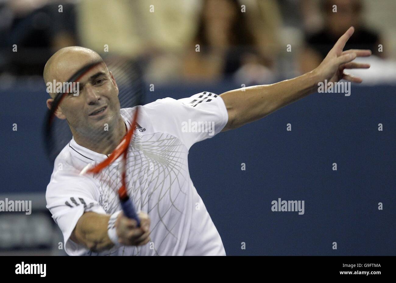 American Andre Agassi in action during his first round match against Andrei Pavel in the US Open at Flushing Meadow, New York. After the tournament he is to retire from tennis. Stock Photo