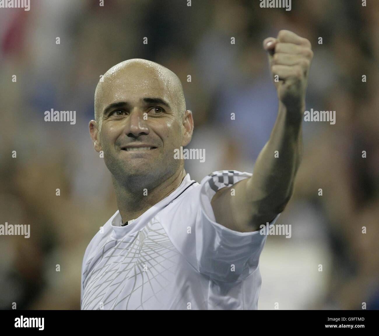 An emotional Andre Agassi celebrates after winning his first round match against Andrei Pavel during the US Open at Flushing Meadow, New York. After the tournament he is to retire from tennis. Stock Photo