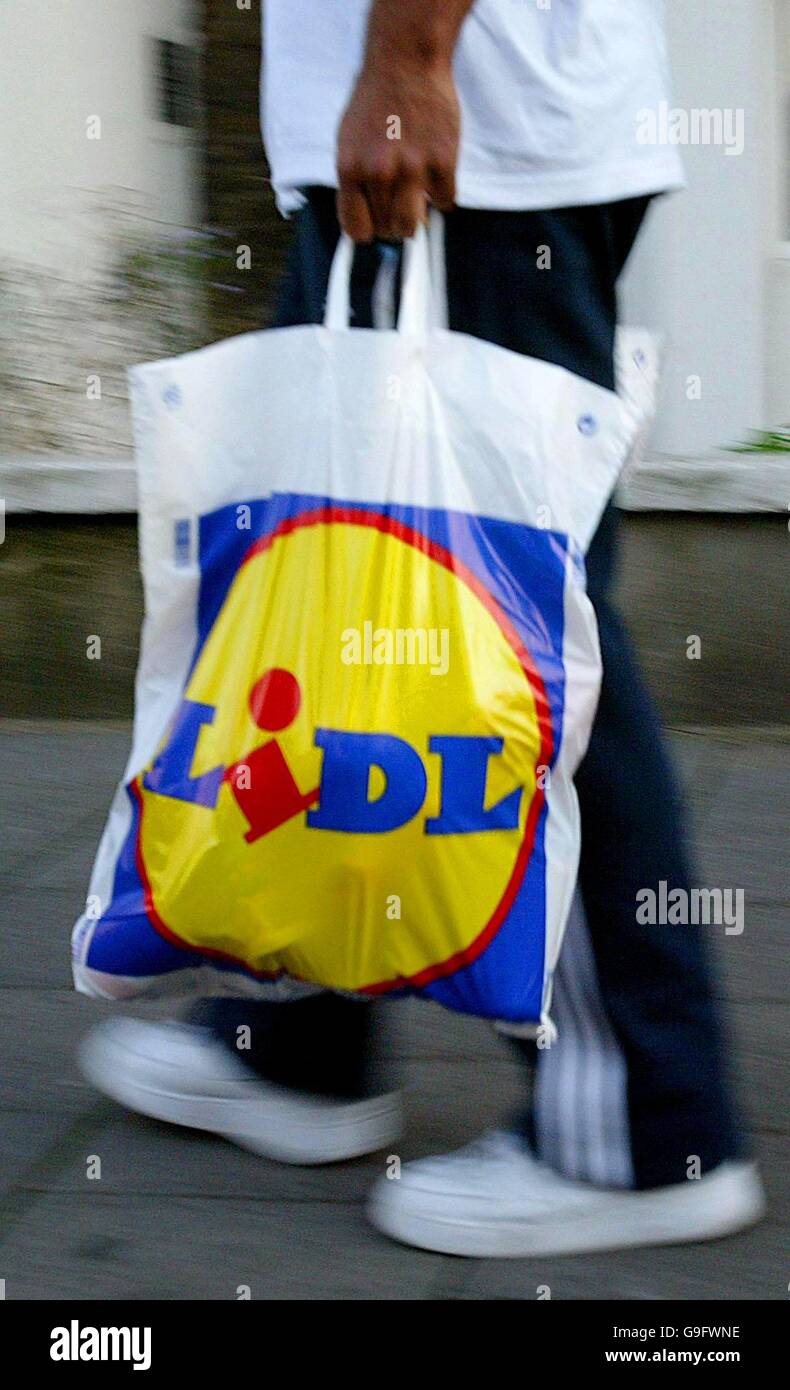 Generic, stock picture of a member of the public carrying a Lidl  Supermarket shopping bag in London Stock Photo - Alamy