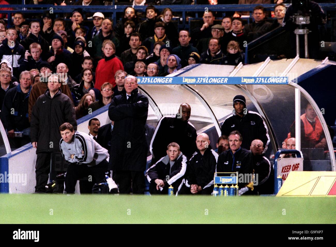 Soccer - FA Carling Premiership - Chelsea v Derby County. Derby County Assistant Manager Colin Todd (second l) and manager Jim Smith (c) watch in despair as they suffer defeat Stock Photo